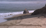 Jim gets away on the sands of Malibu beach.